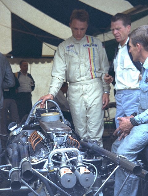 Dan Gurney Standing By Car