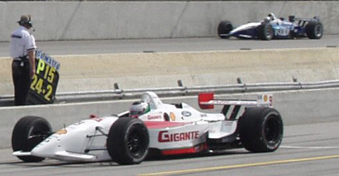 Jourdain on Pit Lane; Franchitti on Track