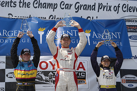 Atlantics Podium Holding Trophies Aloft