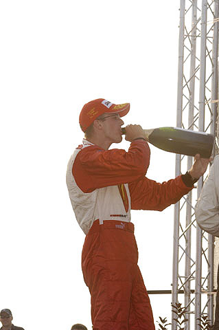 Sebastien Bourdais Drinking Champagne on Podium