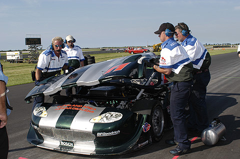 Crew Lifts Hood off Tommy Kendall's Car