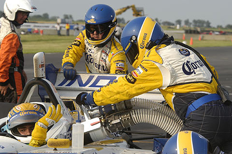 Rodolfo Lavin Giving Water Bottle Back During Pitstop