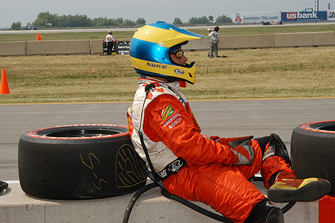 Pit Crew Member Resting on Wall