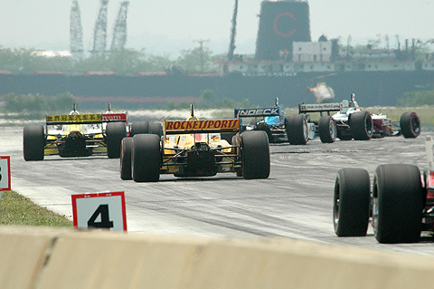 Cars In First Turn w/Ship in Background