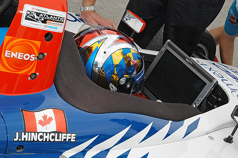 James Hinchcliffe Studying Monitor Sitting in Cockpit