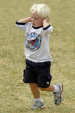 Little Boy Covering His Ears