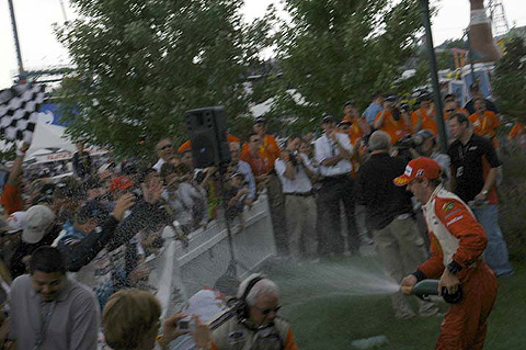 Sebastien Bourdais Spraying Champagne in Crowd