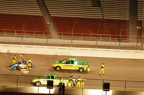 Safety Team Attends To Paul Tracy And His Car