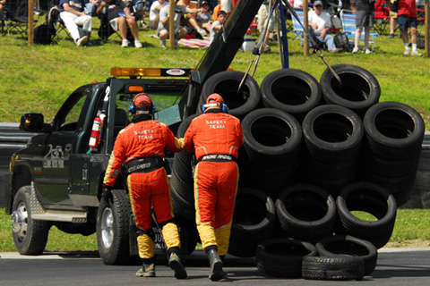 Crew Fixing Tire Wall Knocked Out of Position