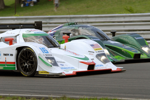 Lola B09 86 Mazda Driven by Chris Dyson and Guy Smith battling Lola B09 60 Judd Driven by Paul Drayson and Jonny Cocker in LMP