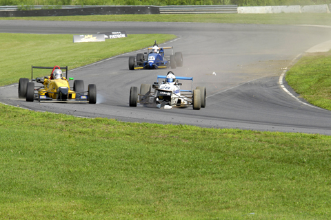 Ardie Greenamyer Slides Across the Track