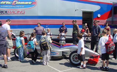 Kids Surround Toyota Atlantic Car