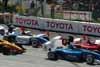 Cars Tightly Packed Through Turn One Thumbnail