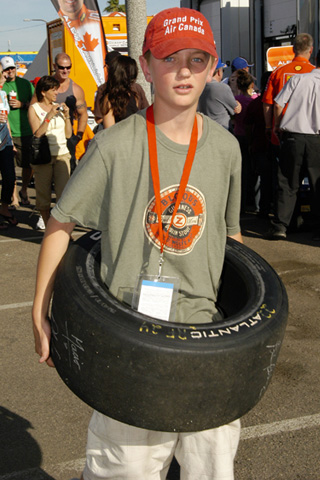 Young Male Fan w/Atlantic Tire Around Waist