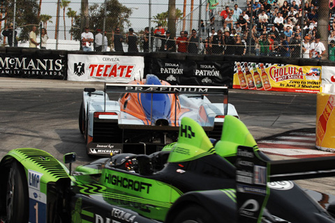 The Aston Martin Leads the HPD ARX-01c Around the Hairpin in LMP