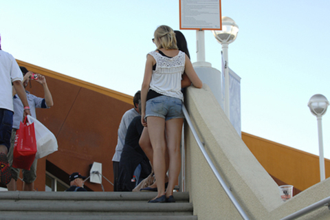 Female Fans Posing for Picture by Stairs