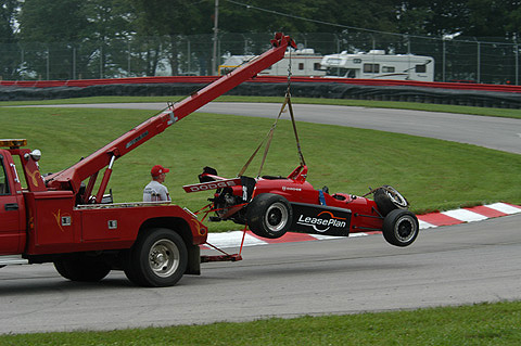 Damaged Barber Dodge Car on Hook