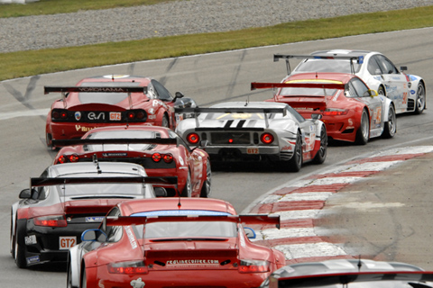 Pack of GT Cars Streaming Through Turn 1