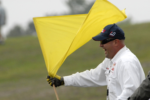 Smiling Marshall Waves Yellow Flag