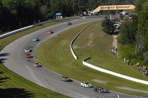 ALMS Cars Streaming Through Turn 4