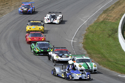 Muscle Milk Car Behind a Pack of Mostly GT Cars