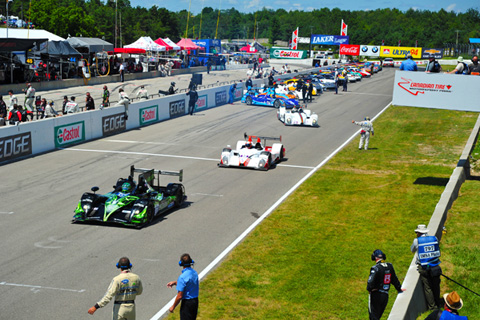 Cars begin to leave grid for their first pace laps