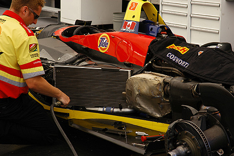 Crew Member Cleaning Radiator