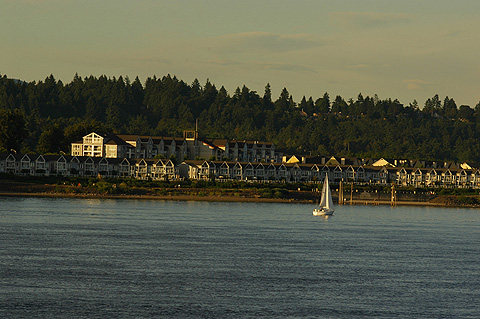 Sailboat in Water in Front of Townhomes