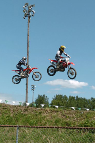Two Motocrossers Flying High