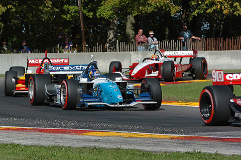 A.J. Allmendinger in Middle of Pack of Cars