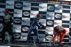 A.J. Allmendinger Spraying Sebastien Bourdais On Podium Thumbnail