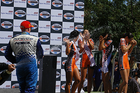 Paul Tracy Sprays Trophy Girls On Podium