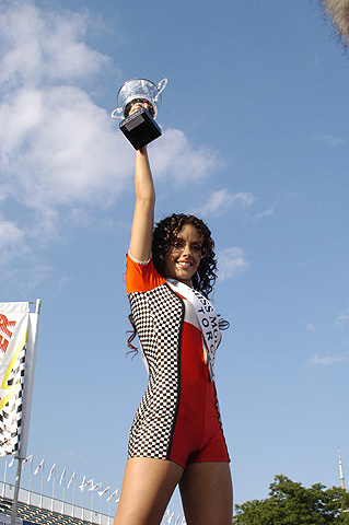 Miss Molson Indy Toronto Winner Holding Trophy Aloft