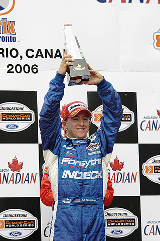 A.J. Allmendinger Holding Trophy on Podium