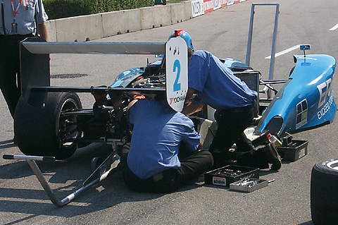 Crew Working On Damaged Tom Bridgman Car