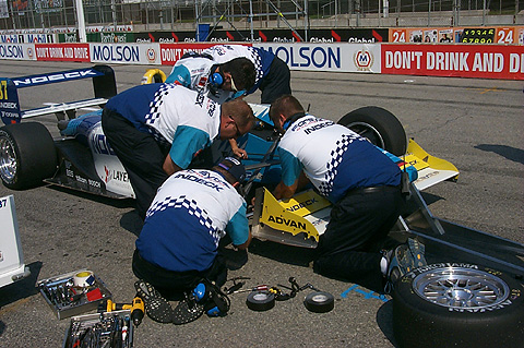 Crew Working On Damaged Andreas Wirth Car