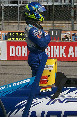 Andreas Wirth Standing by Damaged Car