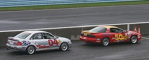 Two Cars Waiting In Pitlane to Start